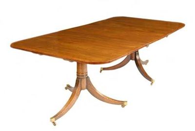 Appraisal: A mahogany twin pillar dining table the cross banded top