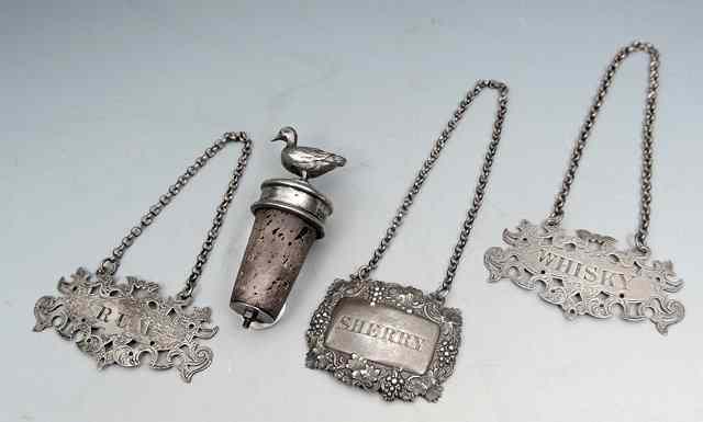 Appraisal: A PAIR OF VICTORIAN SILVER DECANTER LABELS with pierced and