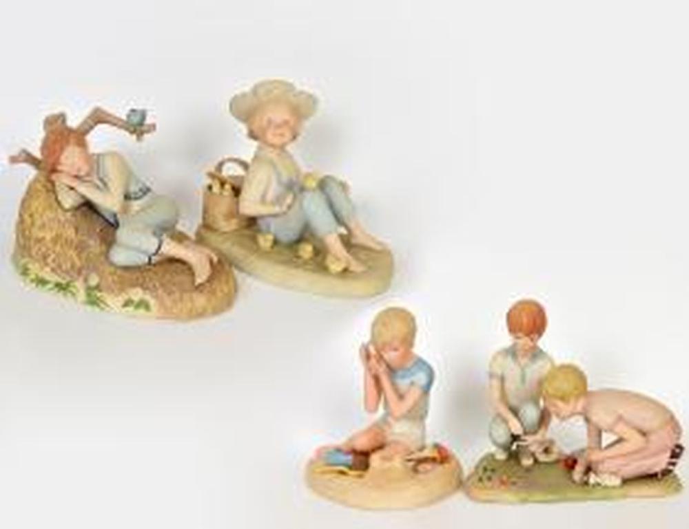 Appraisal: FOUR CYBIS PORCELAIN SCULPTURAL GROUPS OF BOYSMarked Comprising a boy