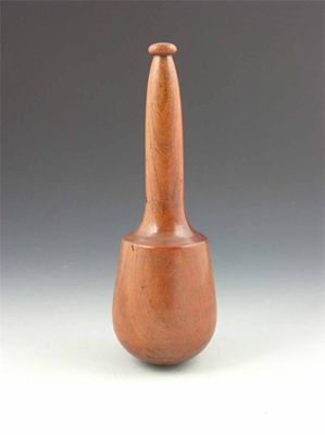 Appraisal: An early th century turned lignum pestle in cm h