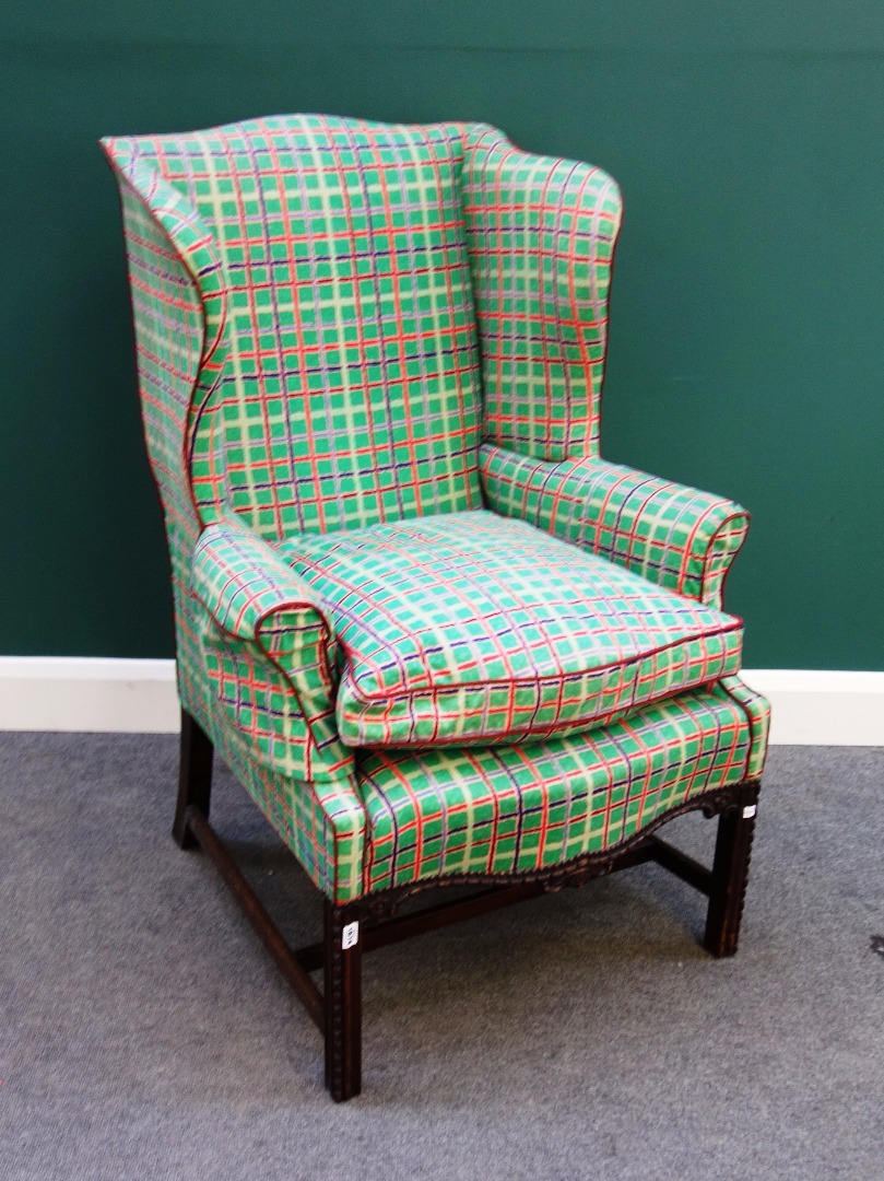 Appraisal: An th century style wing back armchair with serpentine seat