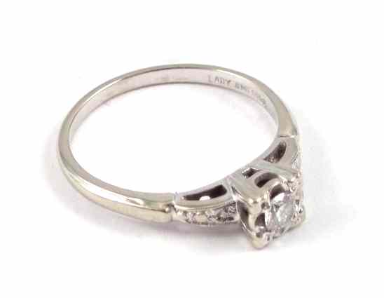 Appraisal: DIAMOND AND FOURTEEN KARAT WHITE GOLD RING set with a