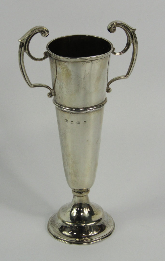 Appraisal: An Edwardian silver twin handled trophy of tapering footed form