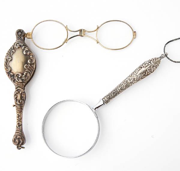 Appraisal: A collection of lorgnettes and magnifying glasses with chains