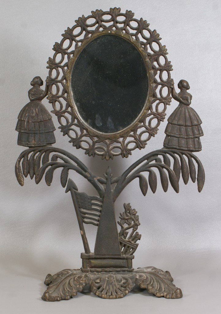 Appraisal: Cast Iron Jenny Lind Mirror ornate mirror supported by Jenny