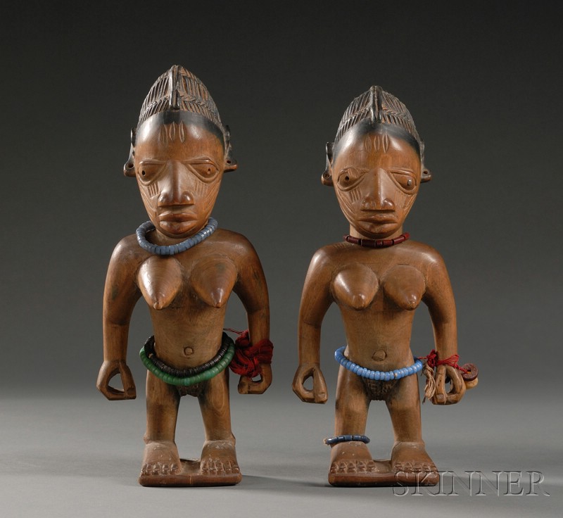 Appraisal: Two African Carved Wood Ibeji Dolls Yoruba female twins with