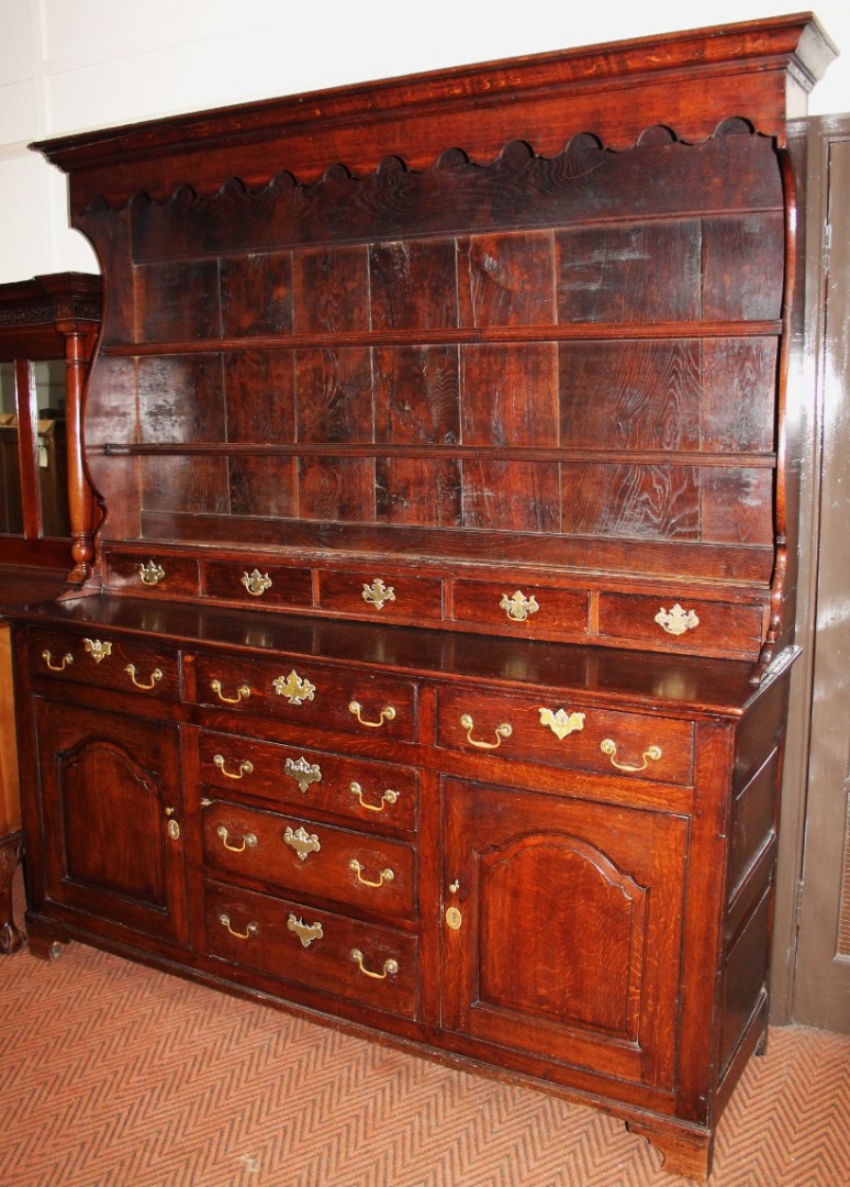 Appraisal: An thC oak Welsh dresser the fixed overhanging moulded cornice