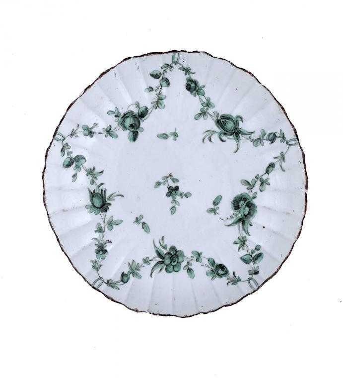 Appraisal: A BRISTOL FLUTED SAUCER-DISH painted in green monochrome with five