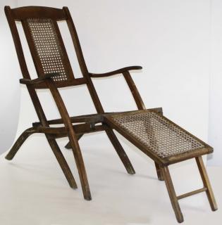 Appraisal: Ca folding cane seat deck chair Ca folding cane seat