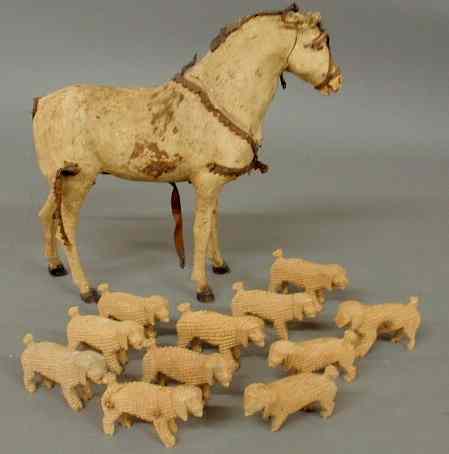 Appraisal: Toy horse with hide covering and black wood feet h