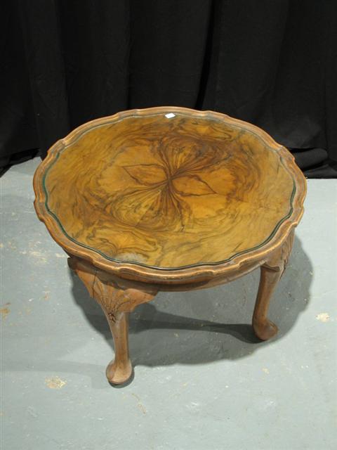 Appraisal: MODERN WALNUT LOW TABLE The circular top raised on cabriole