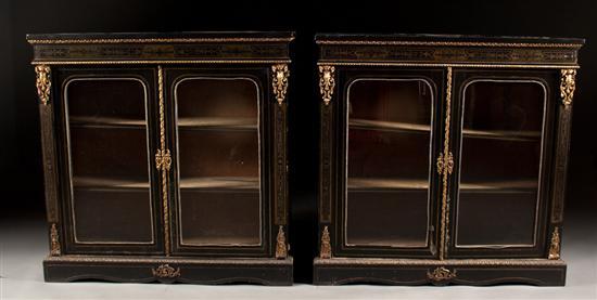 Appraisal: Pair of Regency style brass-mounted and inlaid ebonized wood glazed