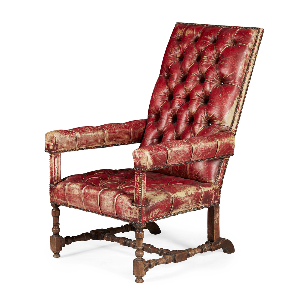 Appraisal: LEATHER UPHOLSTERED WALNUT ARMCHAIR the rectangular back above straight open