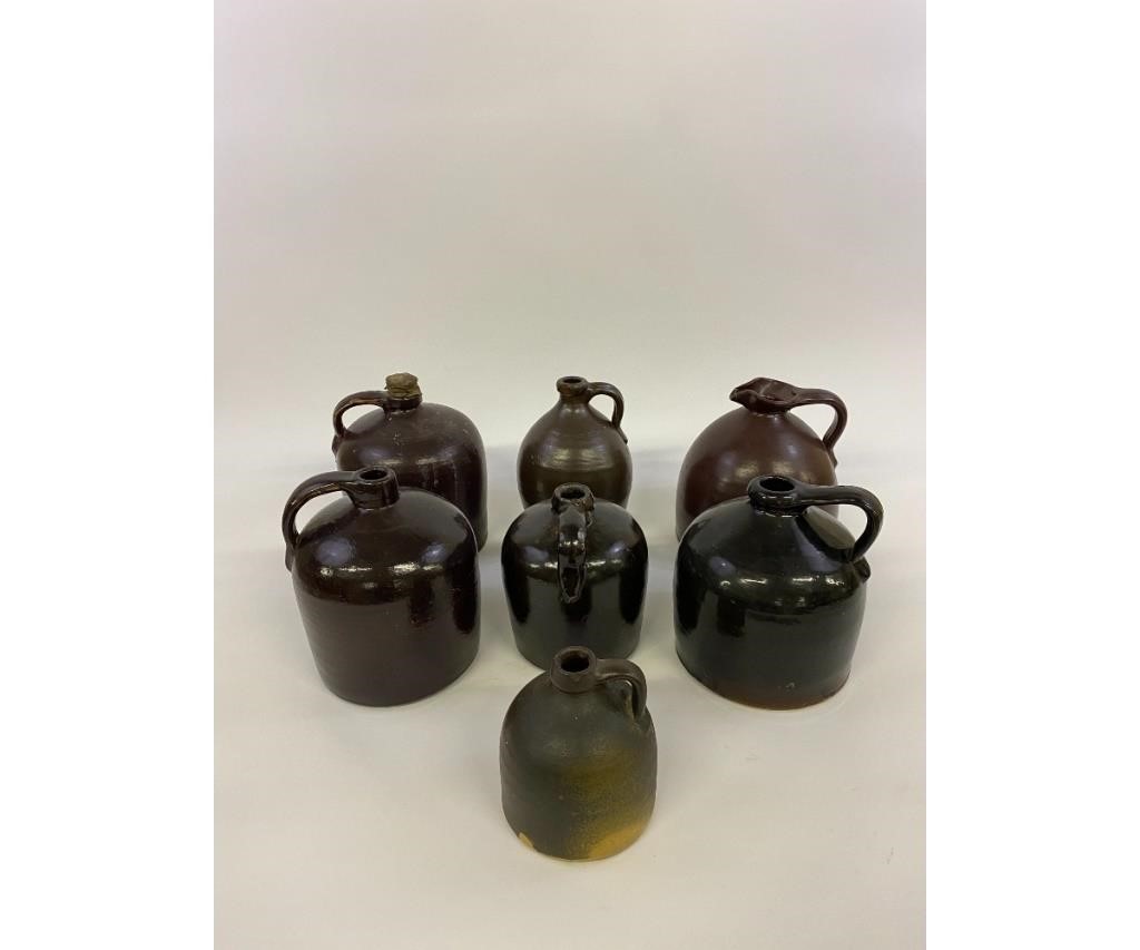 Appraisal: Seven brown stoneware jugs largest h x dia Condition Chips