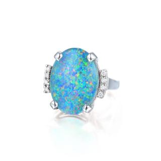 Appraisal: An Opal and Diamond Ring Set with an oval-shaped doublet