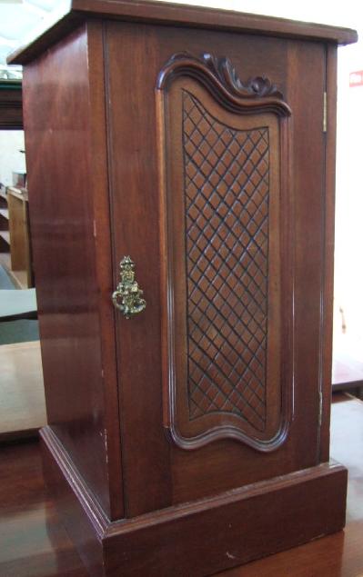 Appraisal: A late th century mahogany pot cupboard with single door