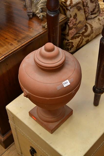 Appraisal: A PAIR OF TERRACOTTA DECORATIVE URNS WITH LION HANDLES A