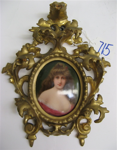 Appraisal: A GERMAN MINIATURE OVAL OIL PAINTING depicting a young beautiful