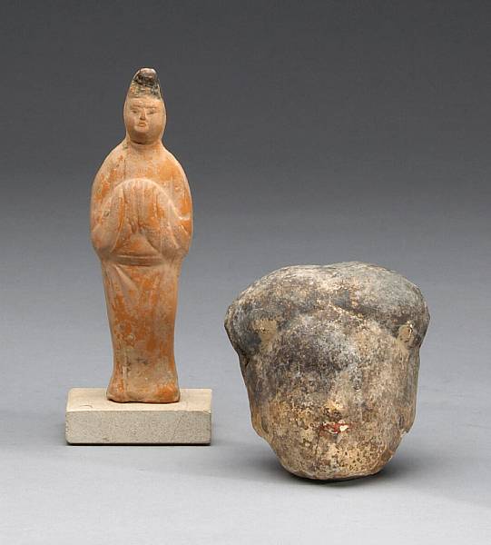 Appraisal: Two painted pottery funerary models The first a head from