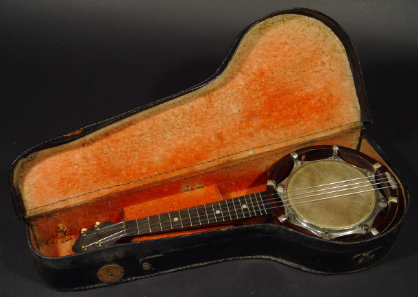 Appraisal: Mahogany banjo with mother of pearl inlaid neck in a