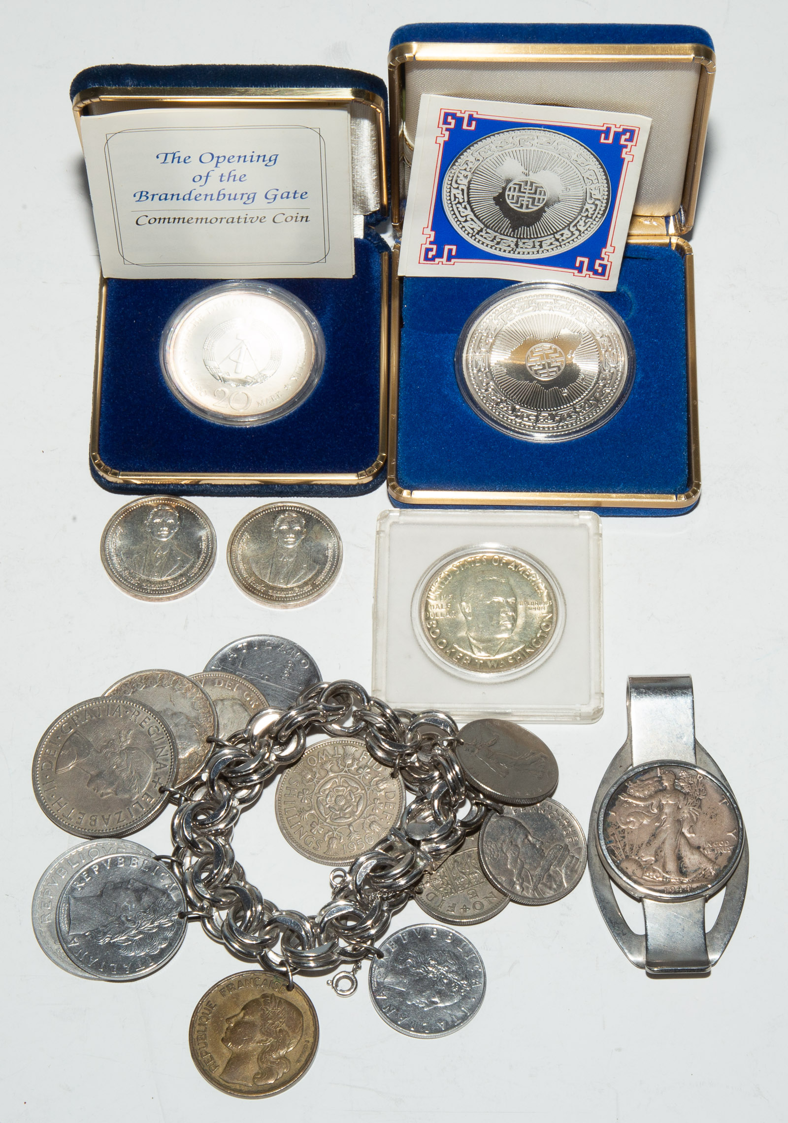 Appraisal: GROUP OF MOSTLY SILVER COINS Includes walking liberty mounted as