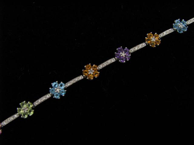 Appraisal: K White Gold multi-gemstone and diamond bracelet in flower design