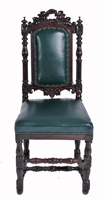 Appraisal: AN ANTIQUE OAK FRAMED GREEN LEATHERETTE UPHOLSTERED CHAIR