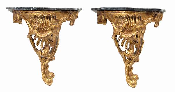 Appraisal: A pair of small Italian Rococo style consoles with marble