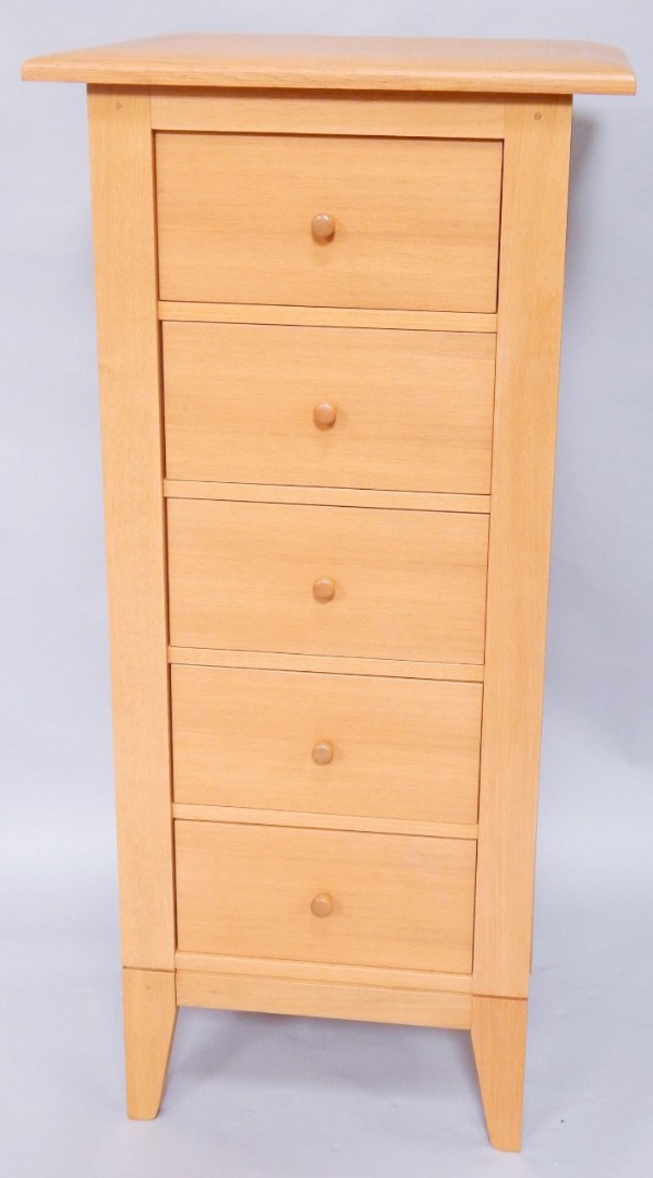 Appraisal: A light oak narrow chest of five drawers width cm