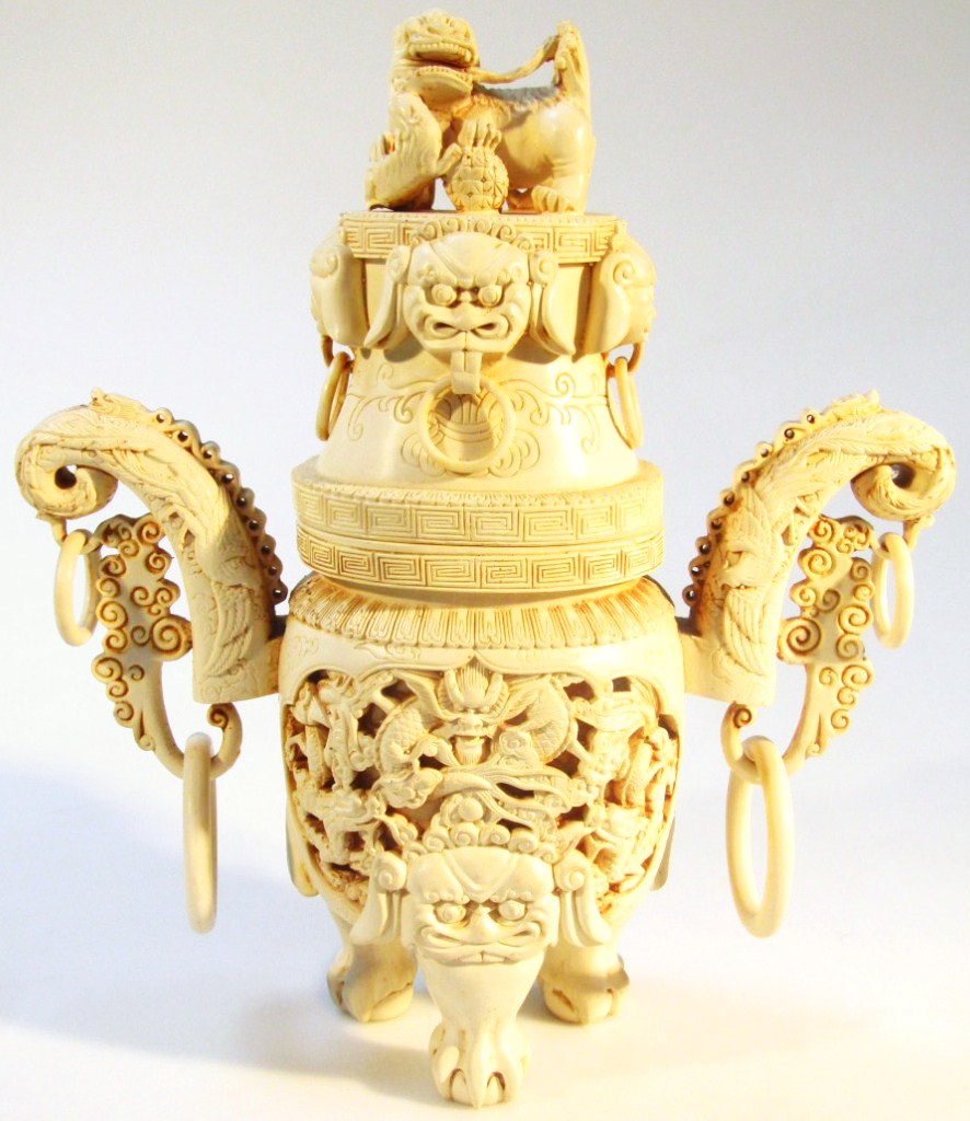 Appraisal: An ivory finish resin censer of elaborate outline with Dog