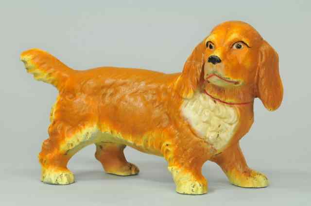 Appraisal: COCKER SPANIEL DOORSTOP Hubley full figured cast iron golden fur