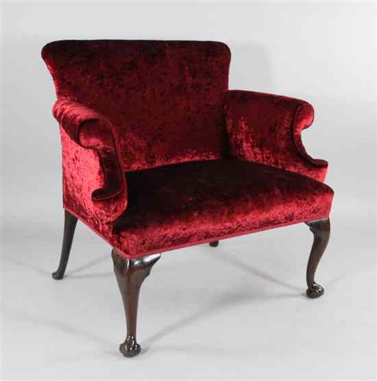 Appraisal: An th century mahogany large size scroll frame armchair on