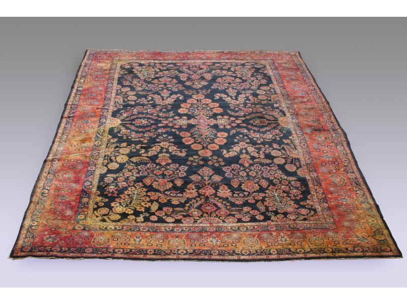 Appraisal: Semi-Antique Sarouk Rug ca central salmon medallion on blue field