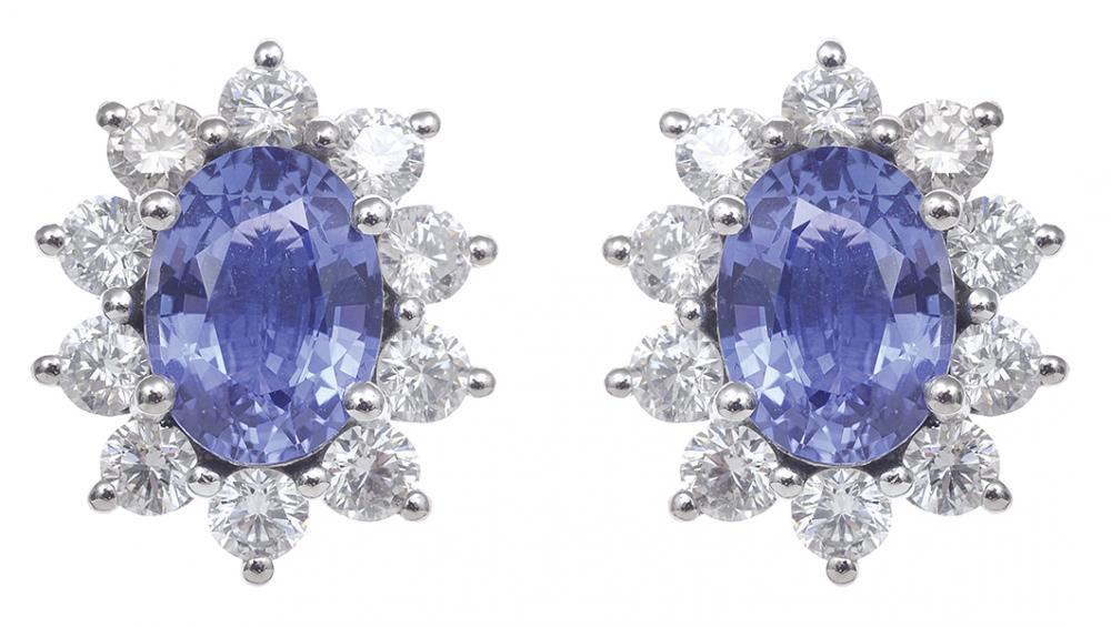 Appraisal: A PAIR OF SAPPHIRE AND DIAMOND EARRINGS Of cluster design