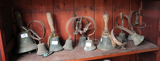 Appraisal: THREE ANTIQUE BRONZE HAND BELLS and a quantity of th