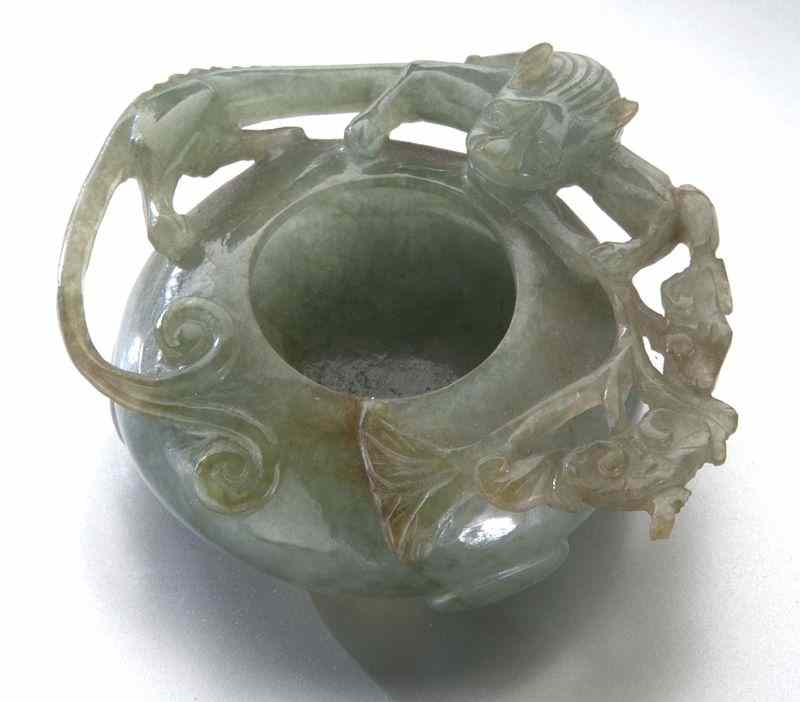 Appraisal: Chinese Qing carved jadeite brush washerdepicting chi dragons and lingzhi