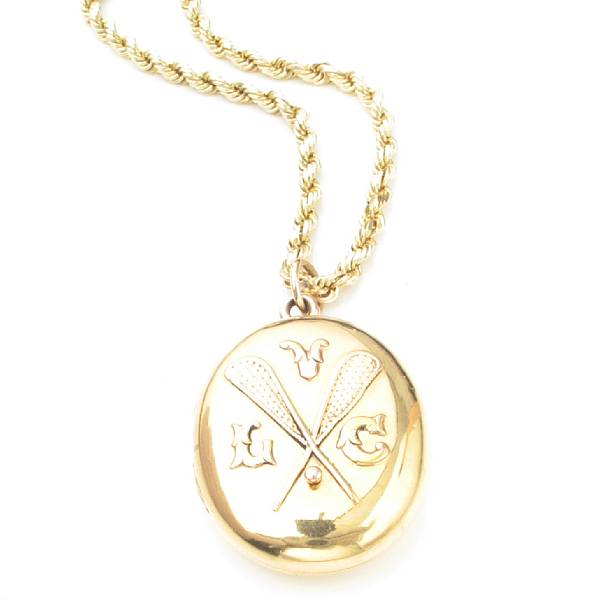 Appraisal: An eighteen karat yellow gold locket with a fourteen karat