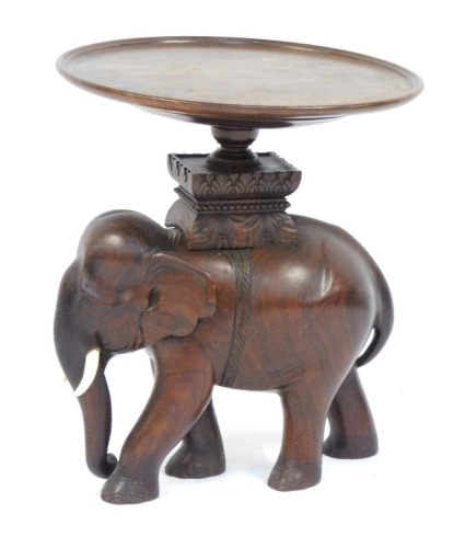 Appraisal: An Indian style mahogany carved elephant table the elephant base