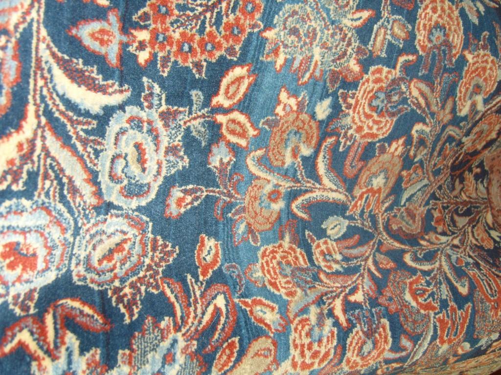 Appraisal: A blue ground eastern wool rug with flowering tree decoration