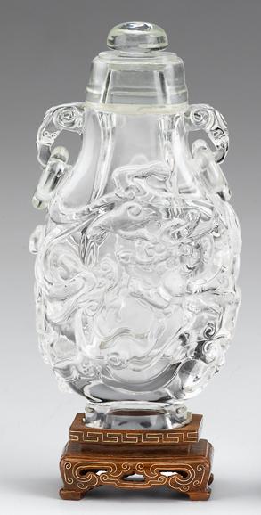 Appraisal: Chinese rock crystal covered vaseDomed cover over open-work vase showing