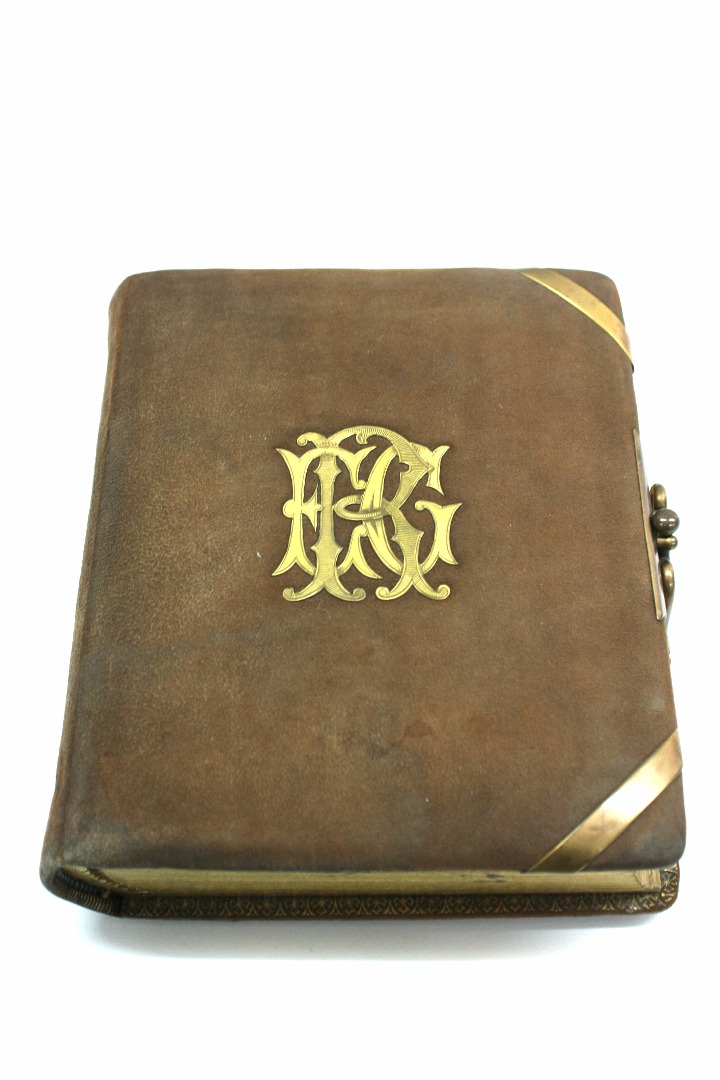 Appraisal: A Victorian brown suede leather photograph album with applied gilt