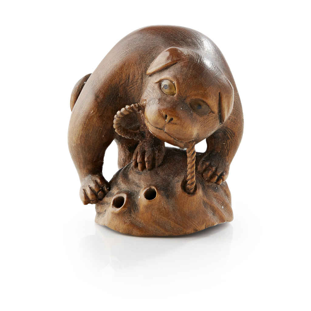 Appraisal: CARVED WOOD NETSUKE OF A PUG SIGNED TOYOMASA MEIJI PERIOD