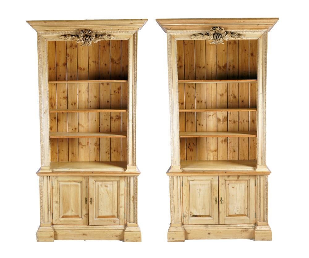 Appraisal: PAIR OF NEOCLASSICAL STYLE PINE BOOKCASESeach constructed in two sections