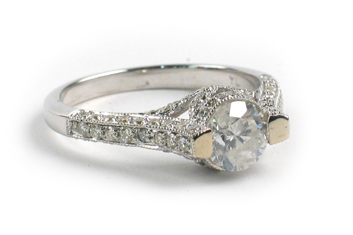 Appraisal: DIAMOND AND EIGHTEEN KARAT WHITE GOLD RING centering a round