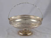 Appraisal: A silver cake basket with pierced gallery and handle by