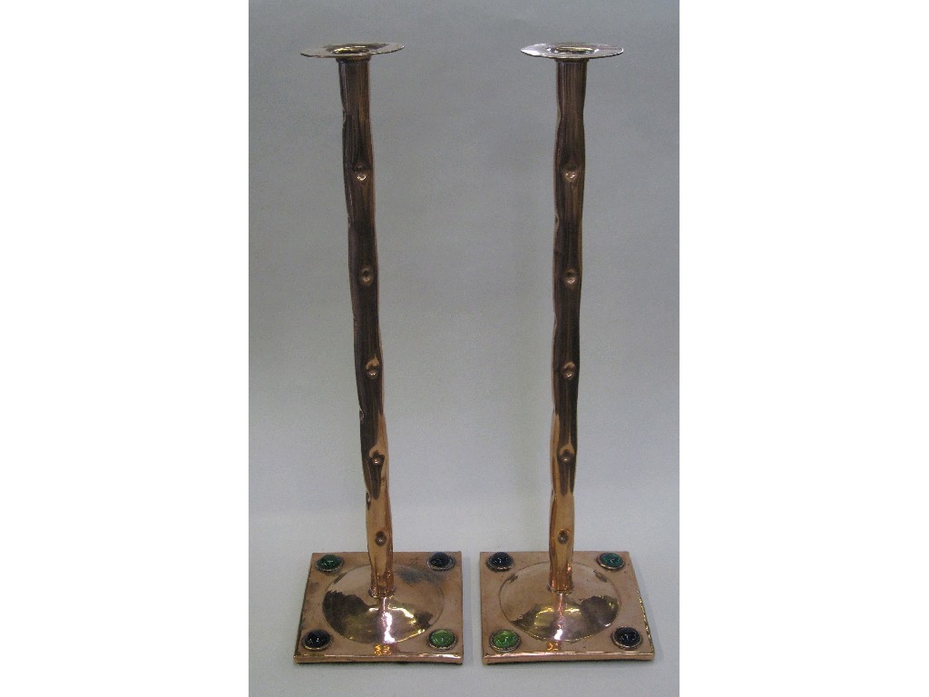 Appraisal: Pair of copper candlesticks the base inset with four glass