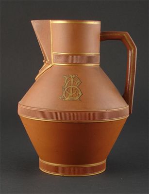 Appraisal: A Watcombe Torquay terracotta jug designed by Dr Christopher Dresser