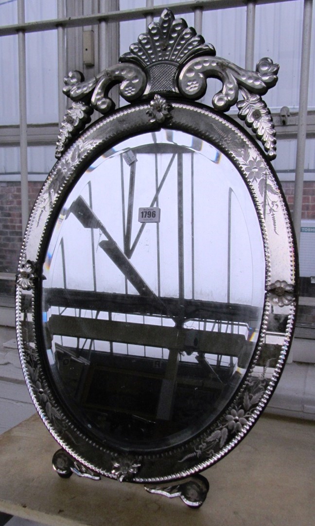 Appraisal: A Victorian etched glass oval mirror with inset bevelled plate