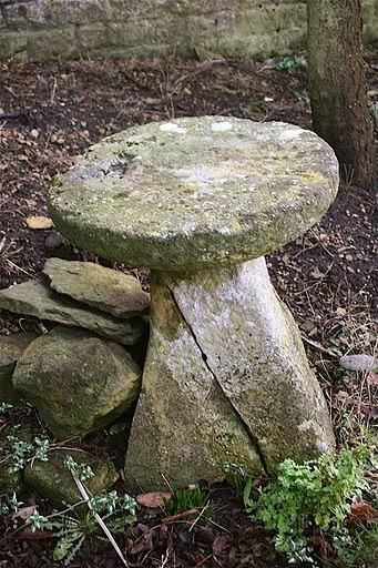 Appraisal: A staddle stone with inverted top and a broken square