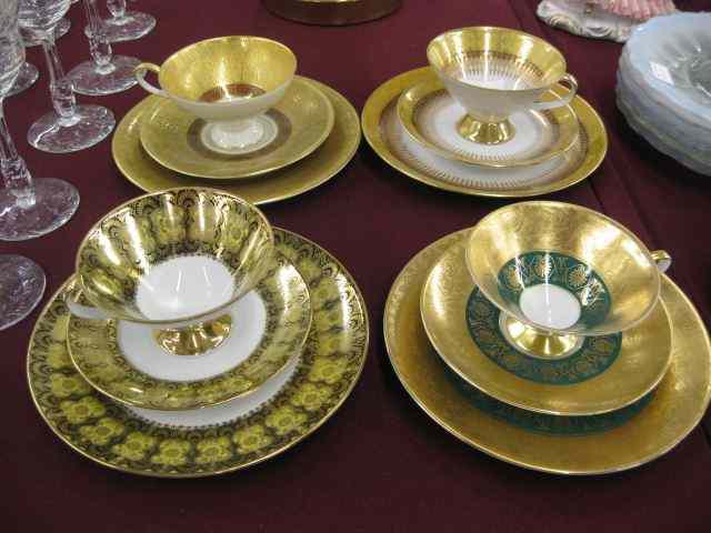 Appraisal: German Porcelain Cup Saucer Dessertplate sets ''Trios'' each gold encrusted